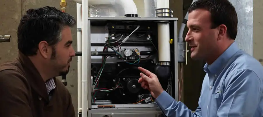 Trane technician talking with a customer about their furnace